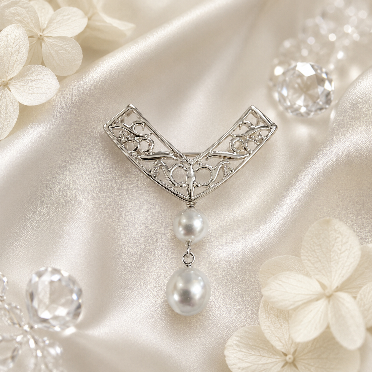 Akoya pearl brooch on ivory satin with floral styling